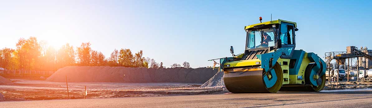 Road rollers working on a road construction site